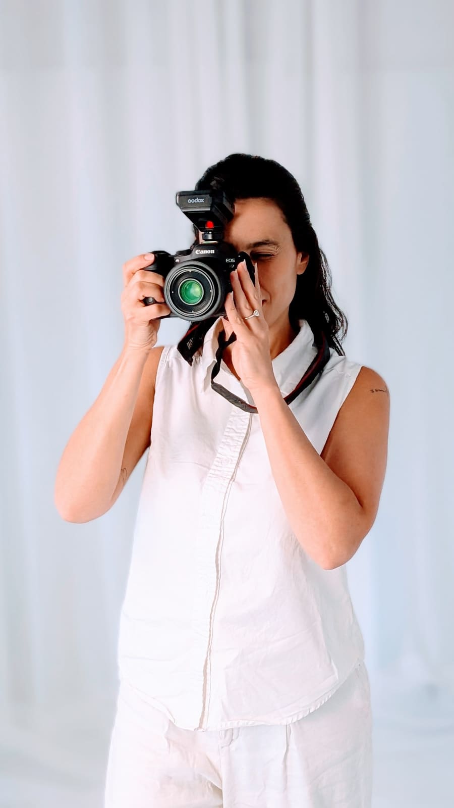 Aline, founder of Aline's Gentle Lens, in her sun-drenched Mona Vale studio